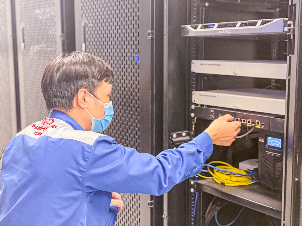 IT techincian man fixing server manage and operate building